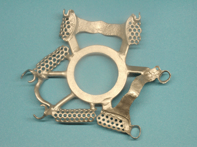 Perfect casting of three metal frames with Cast by Ti-Research ready for further processing