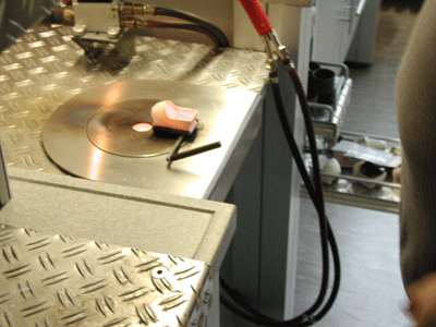 Metal in preheated crucible ready for melting on top of Cast