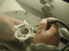 Investment residues are cleaned off with a sand blaster